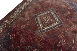 Backside of handmade 1970s Joshagan rug showing knot structure and weave density