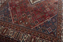 Close-up detail of 1970s Joshagan rug from Iran / Persia showing Wool weave