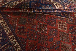 Close-up detail of 1970s Joshagan rug from Iran / Persia showing Wool weave