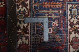 Backside of handmade 1970s Joshagan rug showing knot structure and weave density