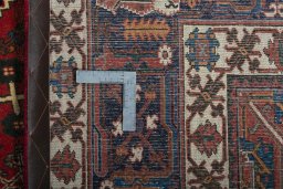 Backside of handmade 2000s Joshagan rug showing knot structure and weave density