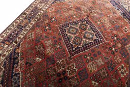 Backside of handmade 2000s Joshagan rug showing knot structure and weave density