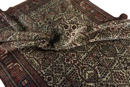 Corner detail of 1950s Joshagan rug showing border pattern and Wool pile