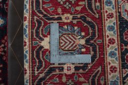 Backside of handmade 2000s Joshagan rug showing knot structure and weave density