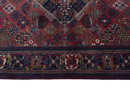 Corner detail of 1970s Joshagan rug showing border pattern and Wool pile