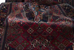 Surface texture of 1970s Joshagan rug with natural Wool and intricate pattern