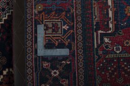 Backside of handmade 1970s Joshagan rug showing knot structure and weave density