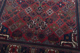 Close-up detail of 1970s Joshagan rug from Iran / Persia showing Wool weave