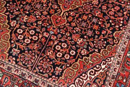 Backside of handmade 1970s Jozan rug showing knot structure and weave density