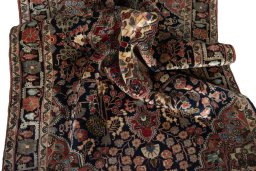 Close-up detail of 1950s Jozan rug from Iran / Persia showing Wool weave