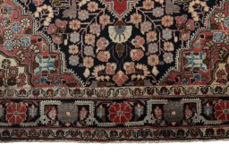 Close-up detail of 1950s Jozan rug from Iran / Persia showing Wool weave