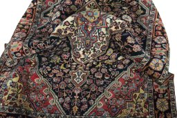 Close-up detail of 1950s Jozan rug from Iran / Persia showing Wool weave