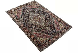 Close-up detail of 1950s Jozan rug from Iran / Persia showing Wool weave