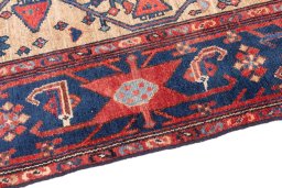 Backside of handmade 1973s Koliai rug showing knot structure and weave density