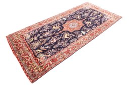 Corner detail of 1975s Koliai rug showing border pattern and Wool pile