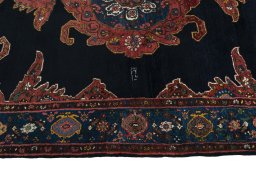 Corner detail of 1950s Kurdi rug showing border pattern and Wool pile