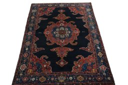 Surface texture of 1950s Kurdi rug with natural Wool and intricate pattern