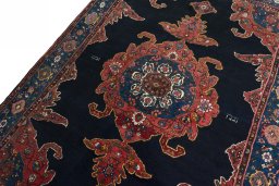 Backside of handmade 1950s Kurdi rug showing knot structure and weave density