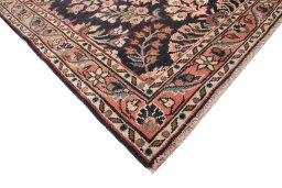 Backside of handmade 1950s Lilian rug showing knot structure and weave density