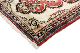 Backside of handmade 1990s Lilian rug showing knot structure and weave density