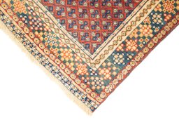 Backside of handmade New Lori rug showing knot structure and weave density