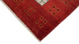 Backside of handmade New Lori rug showing knot structure and weave density