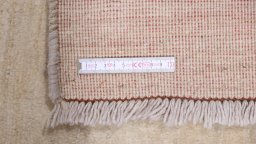 Corner detail of 1980s Lori rug showing border pattern and Wool pile