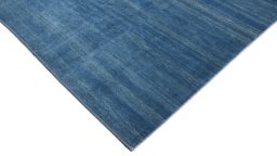 Backside of handmade New Lori rug showing knot structure and weave density