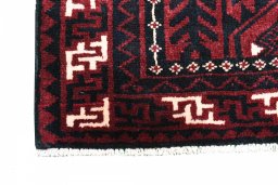 Backside of handmade 2000s Lori rug showing knot structure and weave density