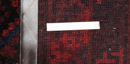 Corner detail of 2000s Lori rug showing border pattern and Wool pile