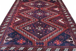 Backside of handmade 2000s Lori rug showing knot structure and weave density