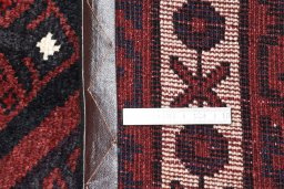 Backside of handmade 2000s Lori rug showing knot structure and weave density