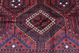 Backside of handmade 2000s Lori rug showing knot structure and weave density