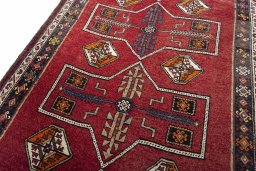Backside of handmade 2000s Lori rug showing knot structure and weave density