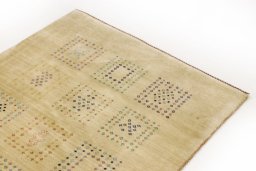 Backside of handmade New Lori rug showing knot structure and weave density