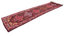 Corner detail of 1920s Malayer rug showing border pattern and Wool pile