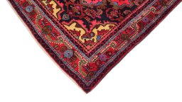 Backside of handmade 1920s Malayer rug showing knot structure and weave density
