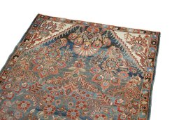 Surface texture of 1920s Malayer rug with natural Wool and intricate pattern