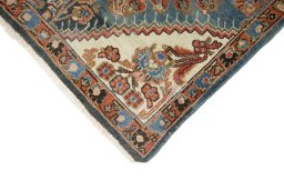 Backside of handmade 1920s Malayer rug showing knot structure and weave density