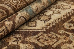 Backside of handmade 1920s Malayer rug showing knot structure and weave density
