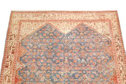 Surface texture of 1920s Malayer rug with natural Wool and intricate pattern