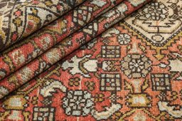 Close-up detail of 1920s Malayer rug from Iran / Persia showing Wool weave