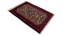 Corner detail of 1970s Malayer rug showing border pattern and Wool pile