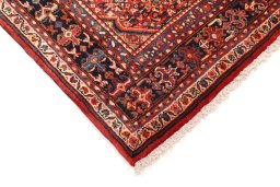 Backside of handmade 1940s Malayer rug showing knot structure and weave density