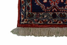 Surface texture of 2000s Malayer rug with natural Wool and intricate pattern