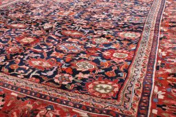 Surface texture of 2000s Malayer rug with natural Wool and intricate pattern