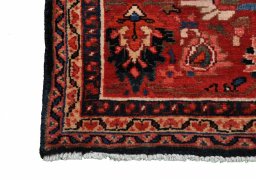 Backside of handmade 2000s Malayer rug showing knot structure and weave density