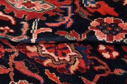Close-up detail of 2000s Malayer rug from Iran / Persia showing Wool weave