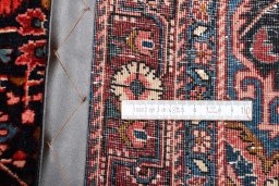 Corner detail of 1970s Malayer rug showing border pattern and Wool pile