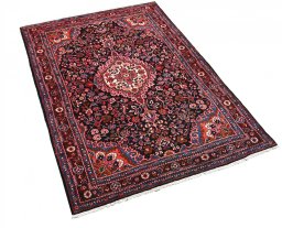 Corner detail of 1970s Malayer rug showing border pattern and Wool pile